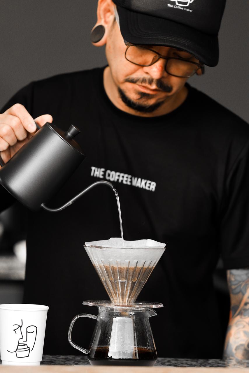 Barista pouring a V60
